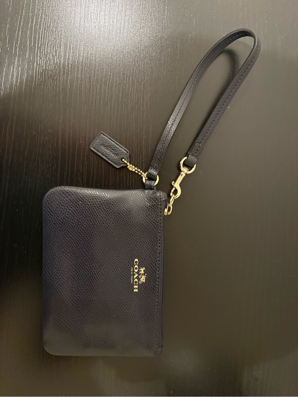 Coach Navy Leather Wristlet with Gold detail and wrist strap